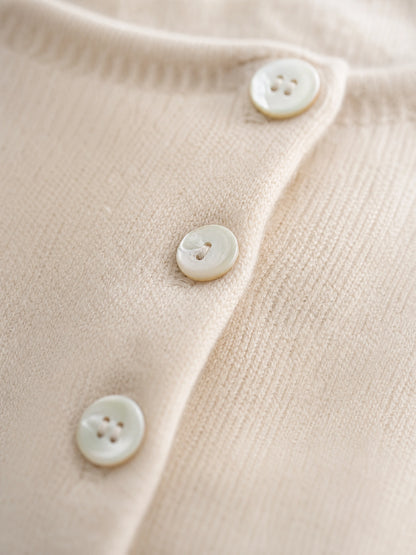grey asymmetric knit sweater Averly London button detail close-up